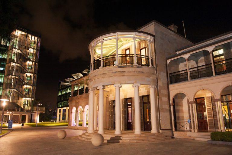 Old Government House Brisbane lit up at night for a corporate event